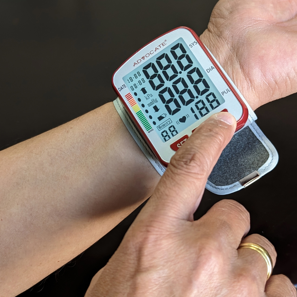 Advocate Wrist Blood Pressure Monitor on a persons wrist