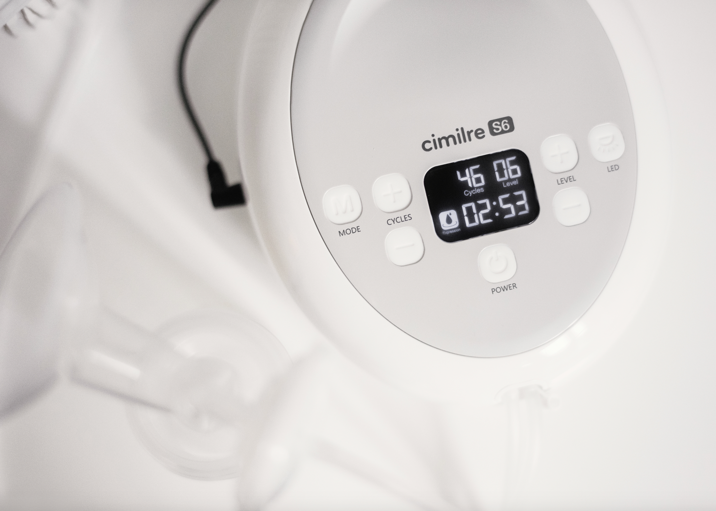 close up of s6 breast pump in expression mode on white counter
